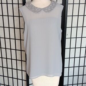 Ann Taylor sleeveless blouse with lace crocheted collar. Size L.